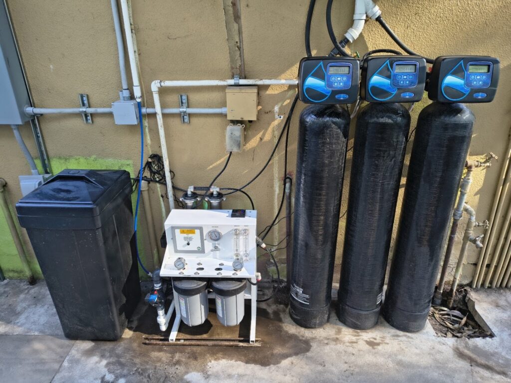 Three whole-house water treatment tanks with electronic control heads