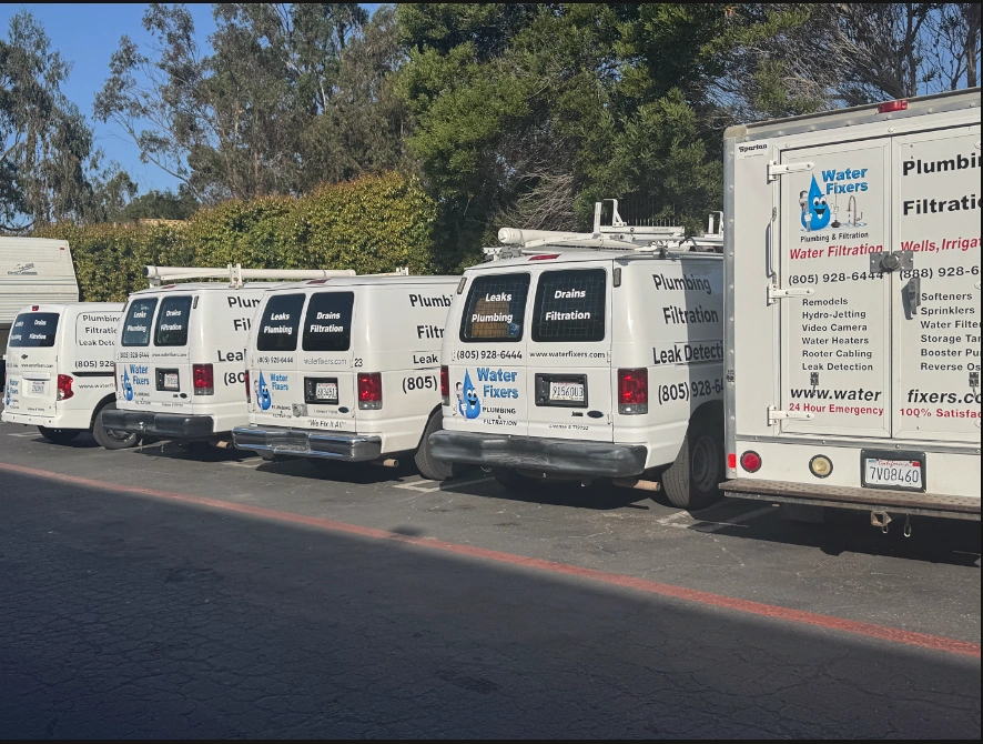Water Fixers plumbing and filtration vans parked together