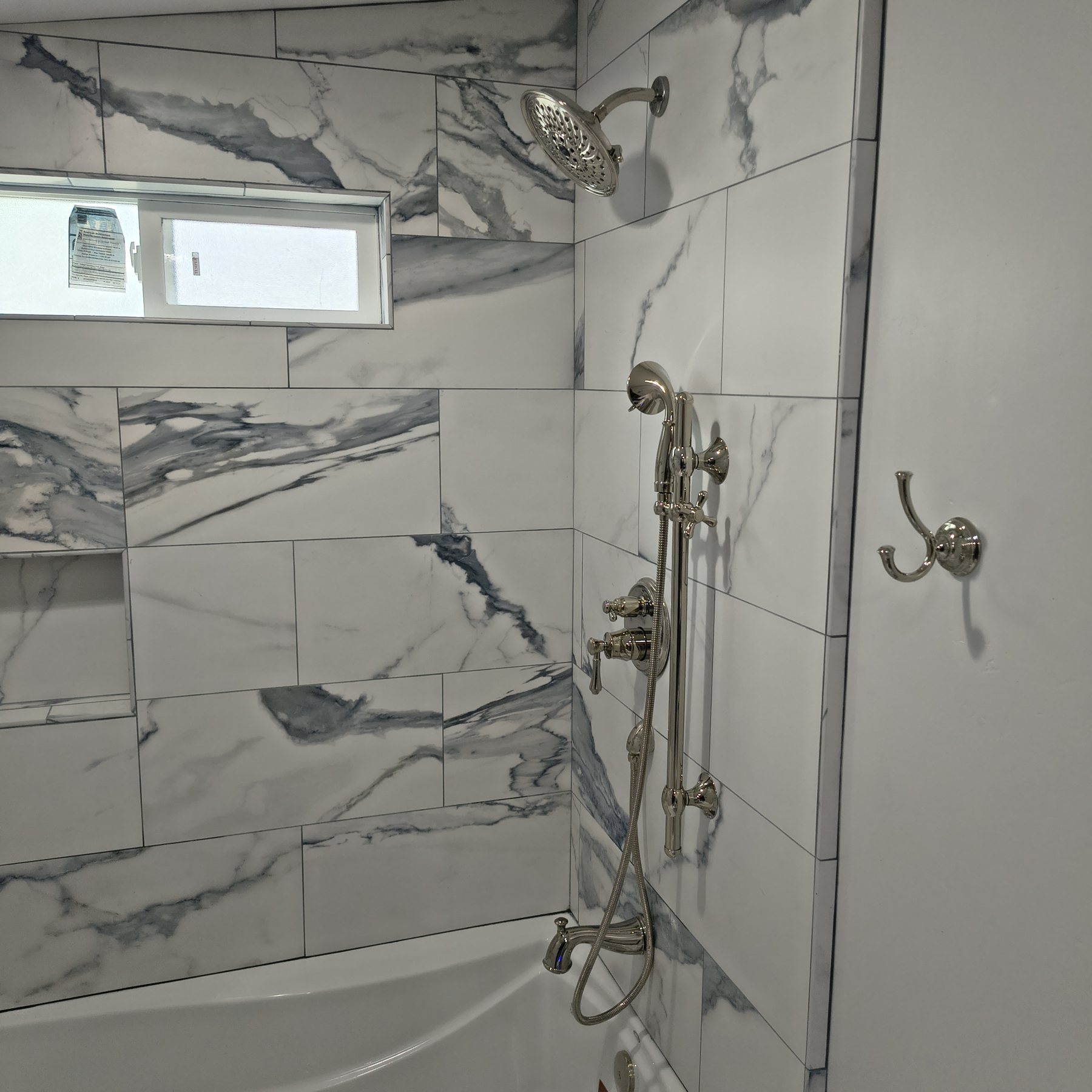 Water Fixers shower fixture and valve installation in a residential bathroom