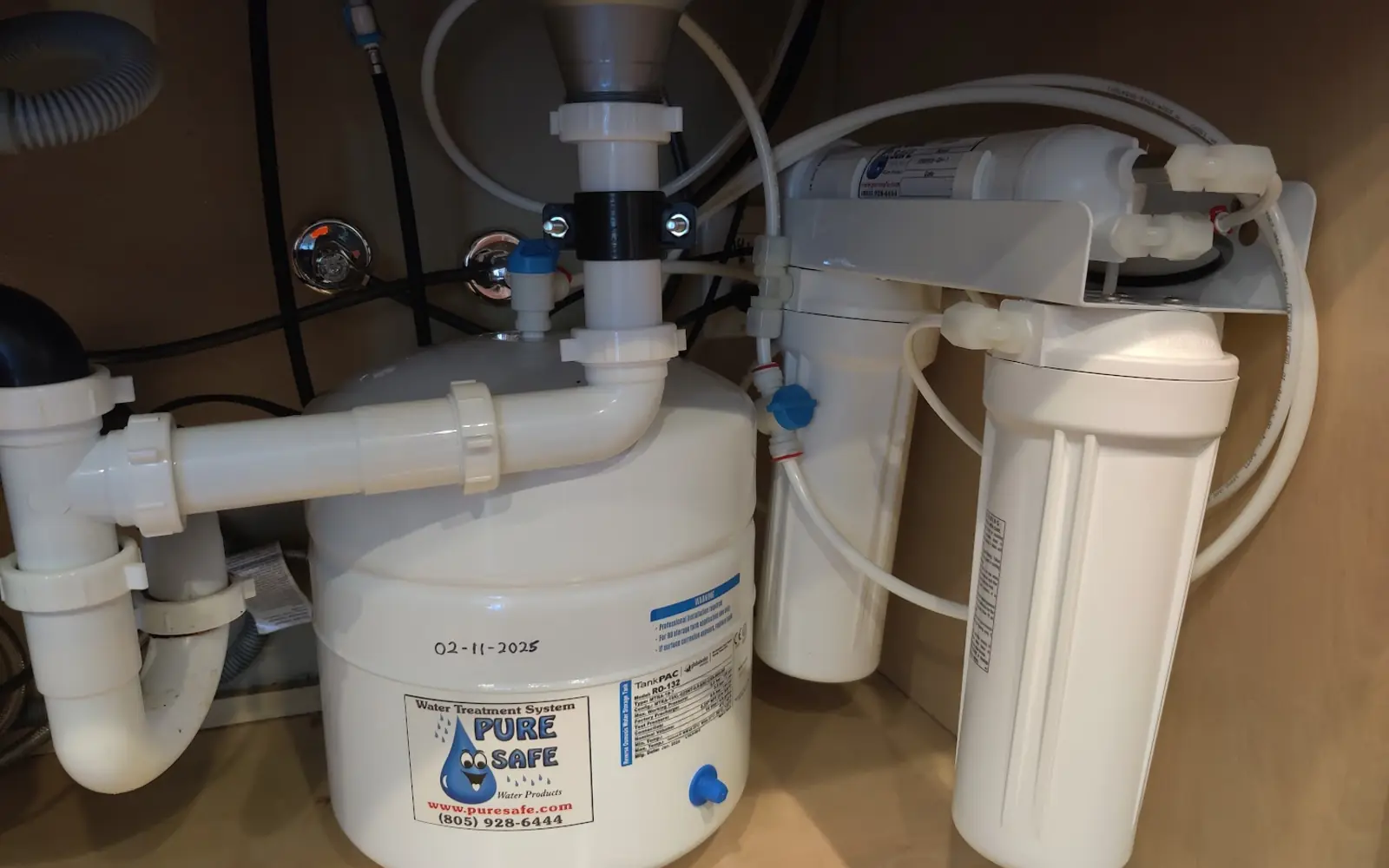 Complete reverse osmosis system installed under a kitchen sink